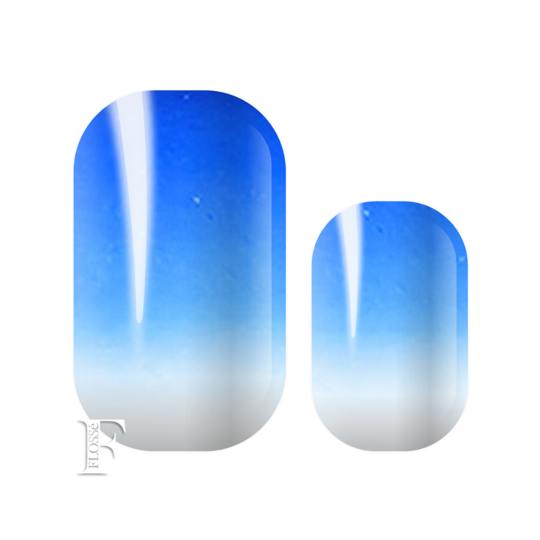 Flossé blue horizon nail wraps. Brilliant sky blue ombre to white at nail base. 