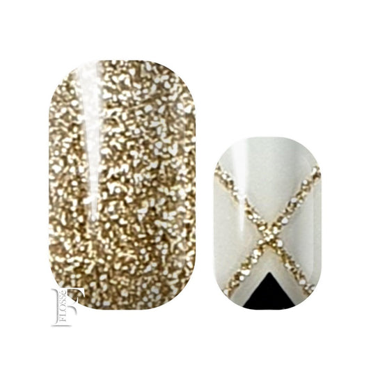 translucent nail wraps with gold glitter and black patterns