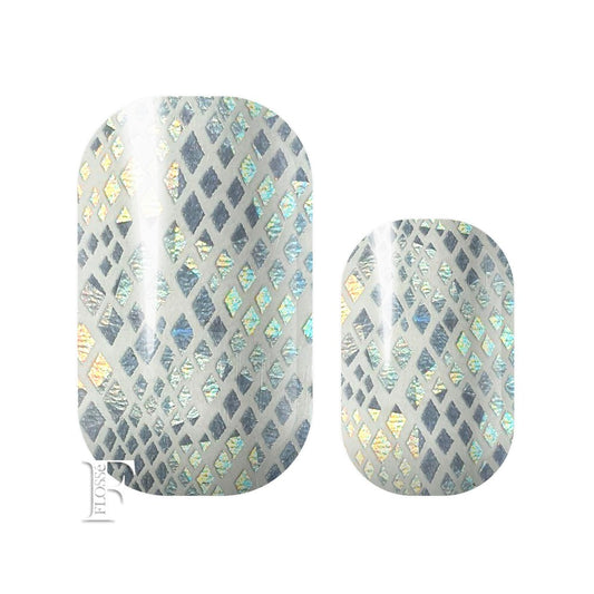 Nail wraps with silver holographic diamond shapes on translucent backing.