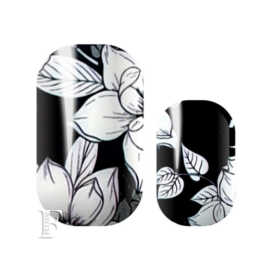 Black base with bold white sketched flower design. FLOSSé Bloomin nail wrap nail stickers