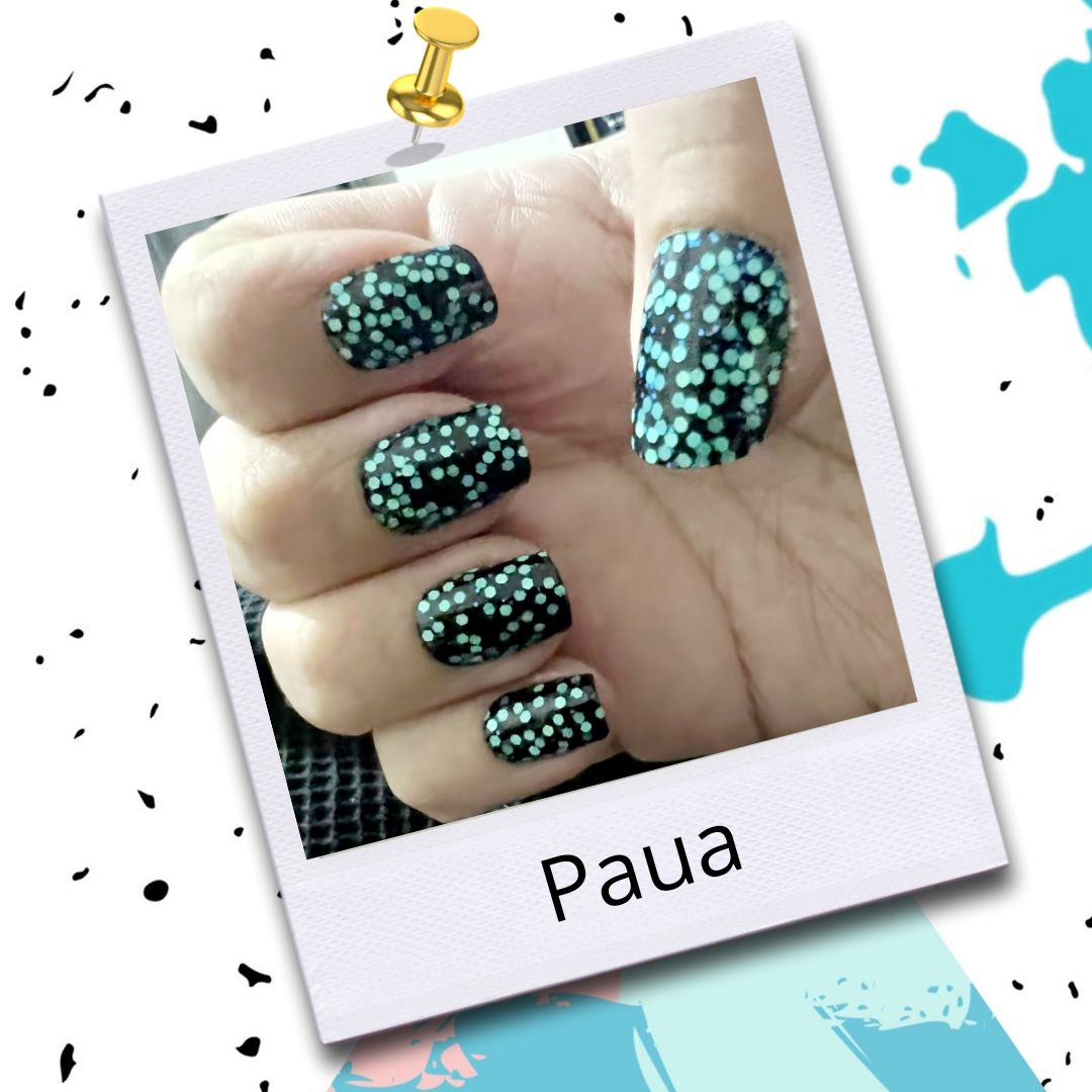 Manicured nails with Flossé nail wraps in Paua. Black base with bright turquoise sequins.