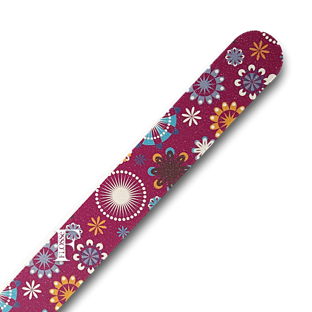 Close up of the purple EVA nail file with multicoloured spiral and flower patterns. FLOSSé nz nail wraps.