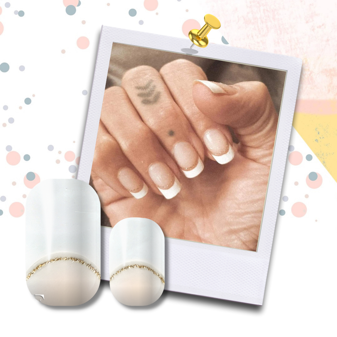 Manicured hands with FLOSSé Bliss nail wraps. White French tips with fine gold glitter arc detail. Transparent base. 