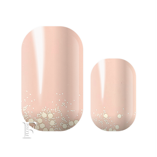 Soft pink block base topped with gold glitter and sequins at the nail base. Flosse swan lake nail wraps.