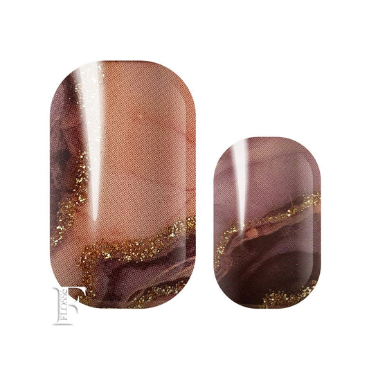 Luxe nail wraps of dark moody blacks and dusky pinks marbled together. Finished with veins of gold glitter.