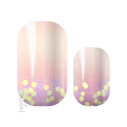 Flossé Tutu nail wraps soft ombré pale pink dished with subtle purple glitter and rose gold sequins at the nail bed. 