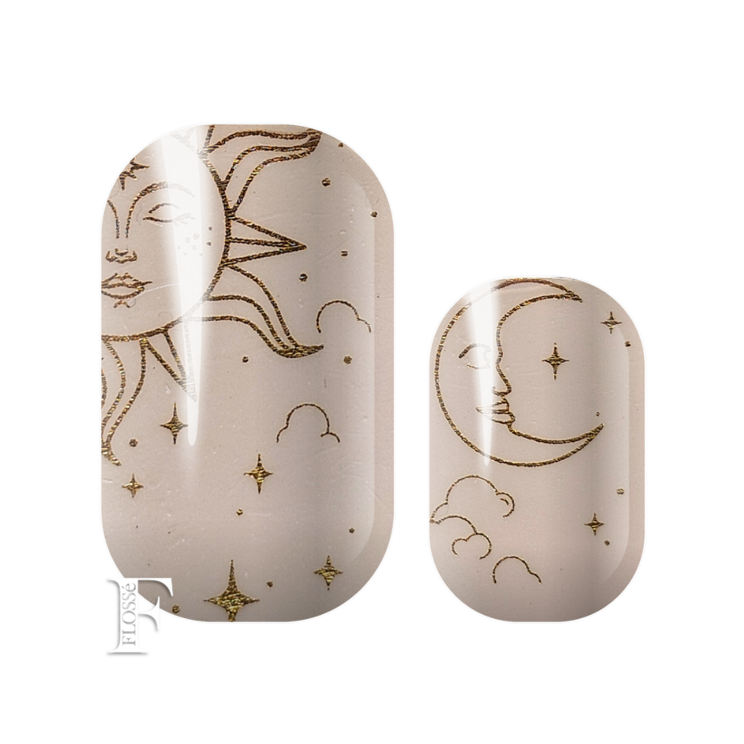 Subtle pink nail wraps with gold foil sun, moon, and star pictures. New Zealand nail wrap stickers. 
