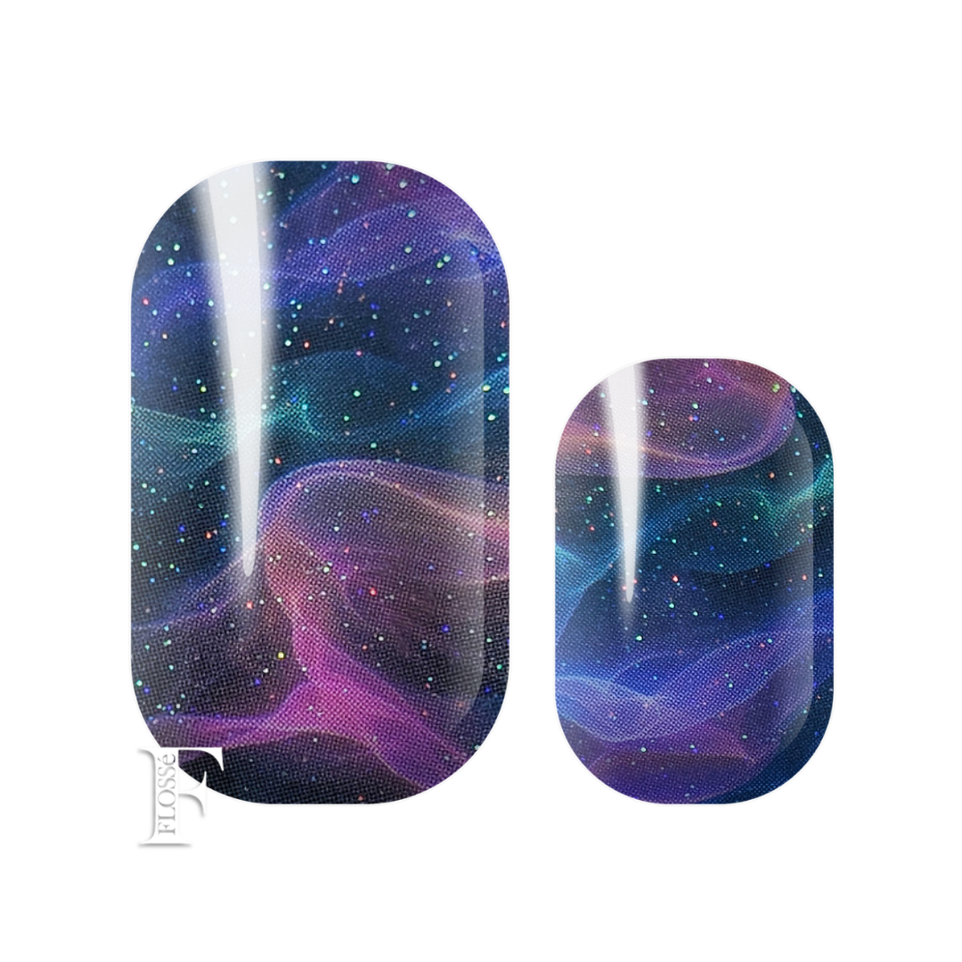 Flossé nail wrap stickers featuring a cosmic design with purple, blue, and pink wavy nebulae and small colorful stars. rich navy and purple hues with flashes of teal, pink and yellow beneath a shimmering holographic glitter.