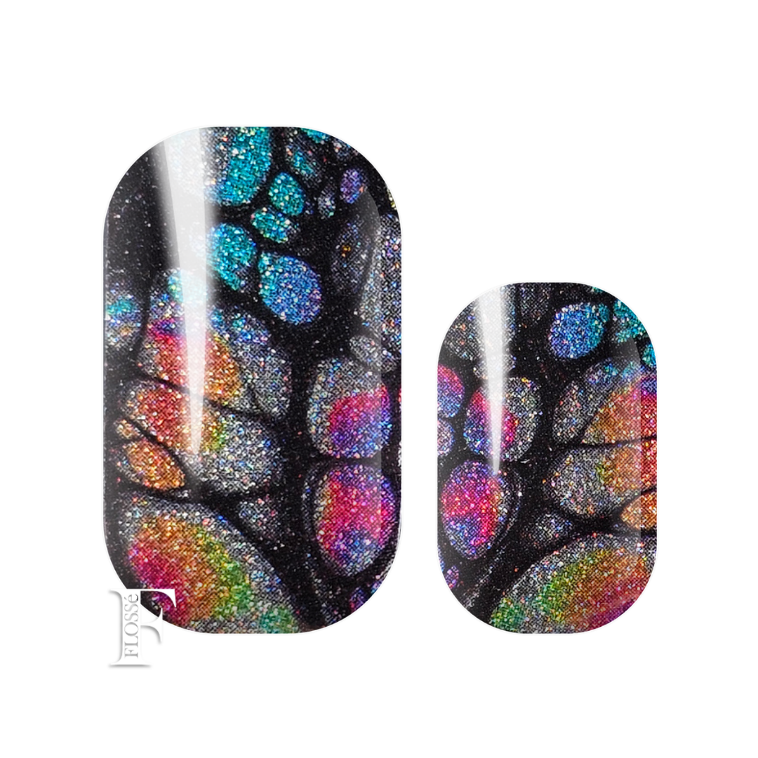 Flossé nail wraps featuring a black pearl shimmering base with a Monarch butterfly pattern filled with iridescent rainbow colours d circular sections. New Zealand nail wrap stickers. 