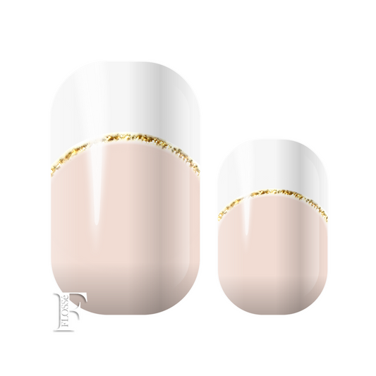 Crisp white French tips with translucent base and fine gold glitter arc over the nail moon. 