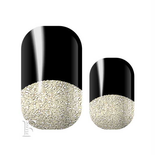 Black tipped French manicure styled nail wraps with a bright silver glitter nail base. 