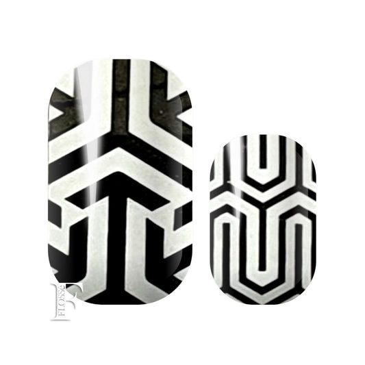 black and white nail wraps with geometric designs in black