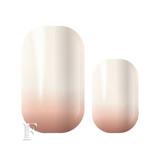 Peaches and cream nail wraps. Soft peach at the nail base ombre to white at the finger tip.