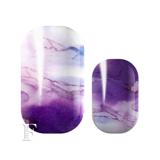 Marble watercolour patterned nails wraps with colours of blues, lilac, purples.  