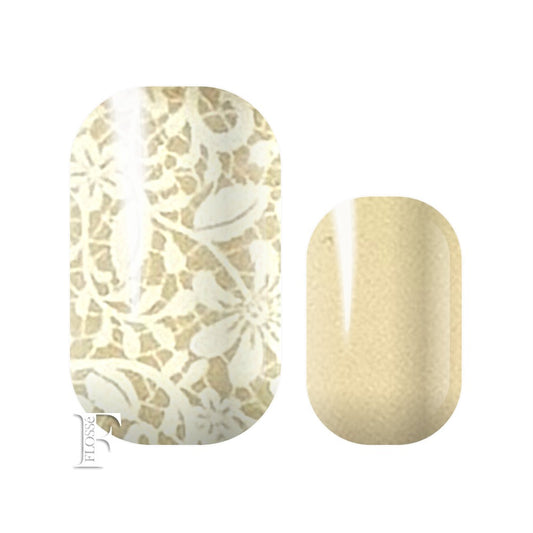 nail wraps with soft pinky beige base with white floral lace pattern on top