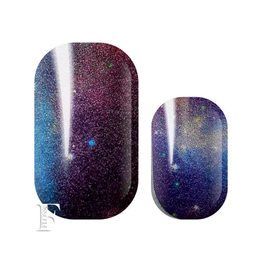 Nail wraps the colour of the galaxy. Blues, purples and silver. Pearl finish.
