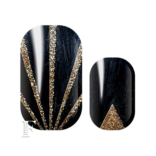 Gloss black nail wraps with triangle and line details in gold glitter.