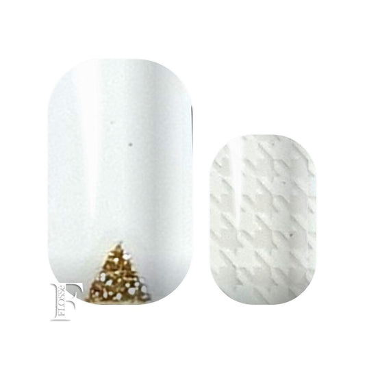 white nail wraps with translucent sections and gold glitter accents