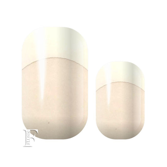 Nail wraps with French white tips and translucent base.