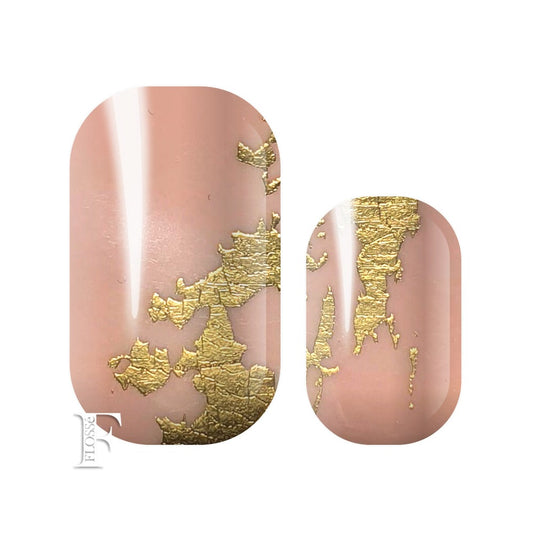 Soft pink nail wrap topped with gold foil.