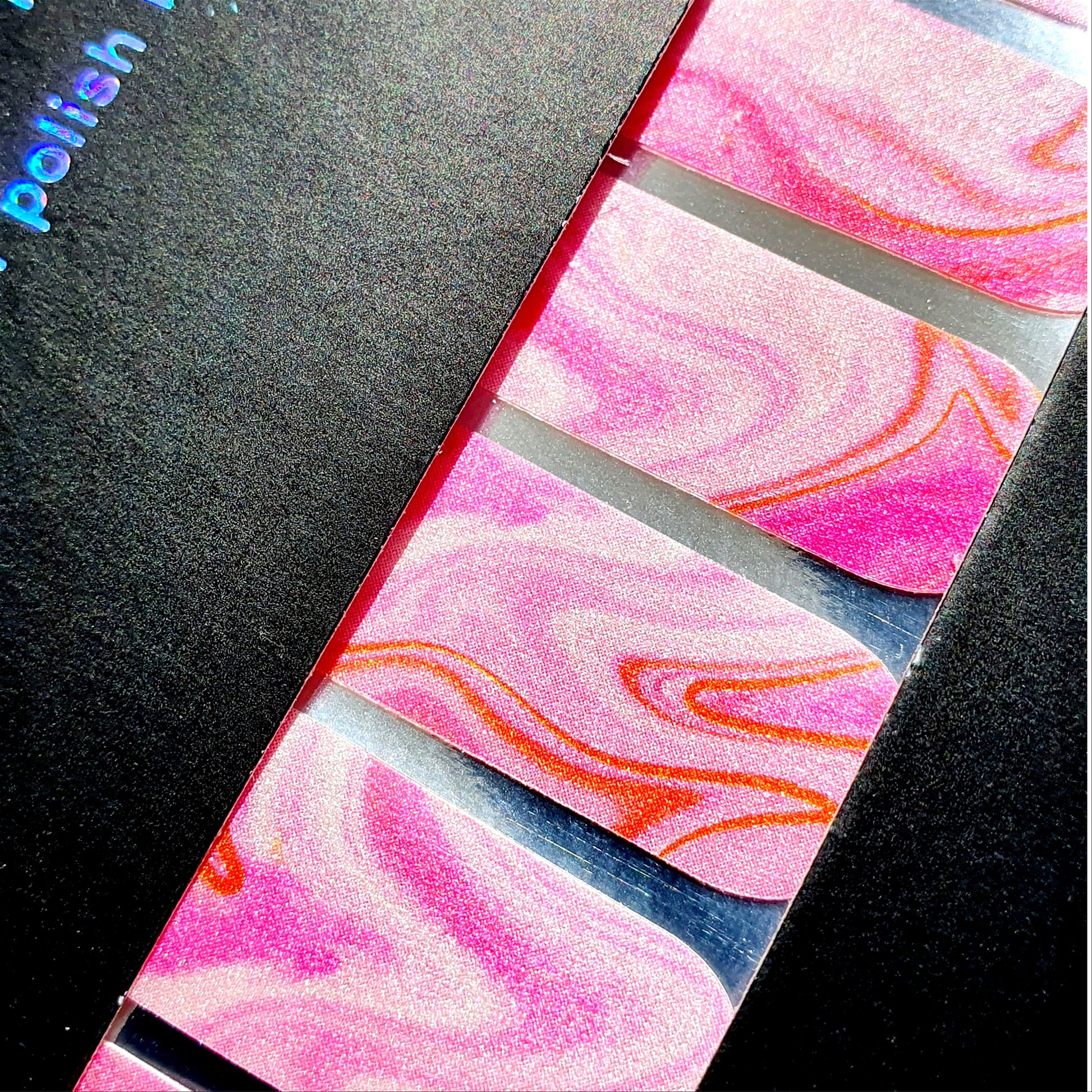 Close up of pearl shimmer on Strawberry Sunday nail wraps.