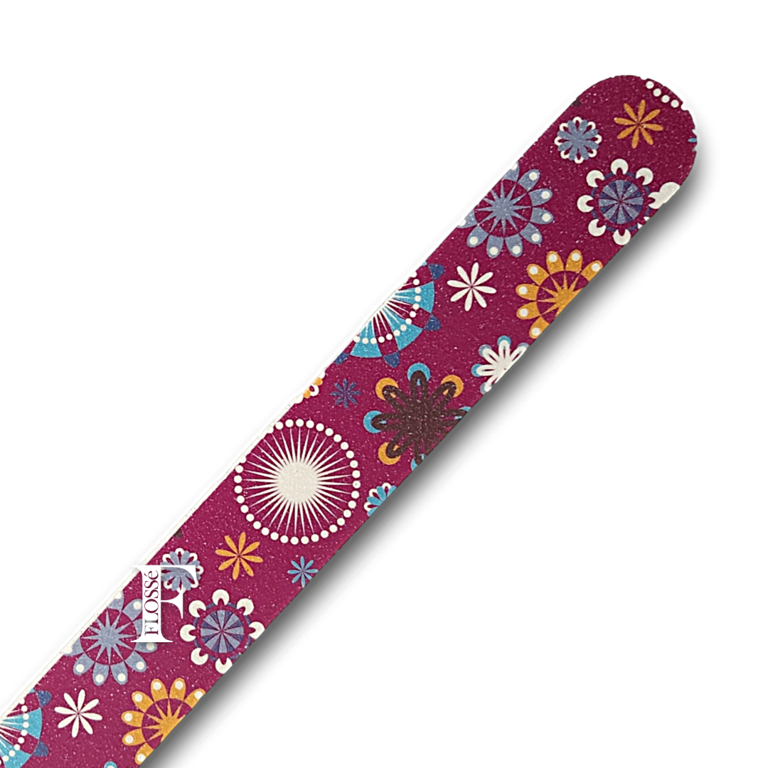 Close up of the purple EVA nail file with multicoloured spiral and flower patterns. FLOSSé nz nail wraps. 