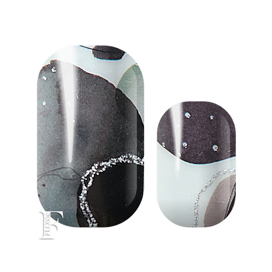 Black and white watercolour pattern with silver glitter detailing.  FLOSSé Speckled black nail wraps. 