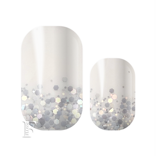 Gorgeous white block nail wraps with silver holographic glitter and sequins in ombre style starting the the nail base. Flosse nail wraps. 