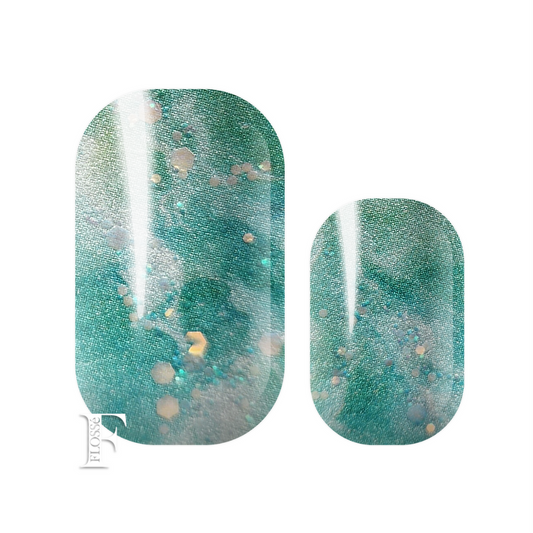 Nail wraps with green and white marbled colours of Jade. Lightly ripped with glitter and gold sequins. FLOSSé Jade nail wraps. 