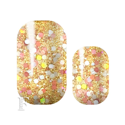 nail wraps with soft gold glitter base, topped with pink and silver sequins