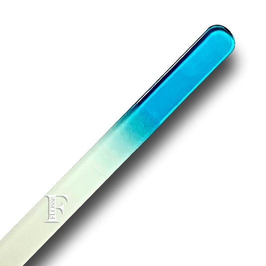 Blue Double sided crystal glass micro nail file that never goes blunt. Made with a finer grit compared to emery board files. making it more gentle on nails.  Simply wash clean under running water, and gently pat dry. 14cm x 1.2cm x .3cm