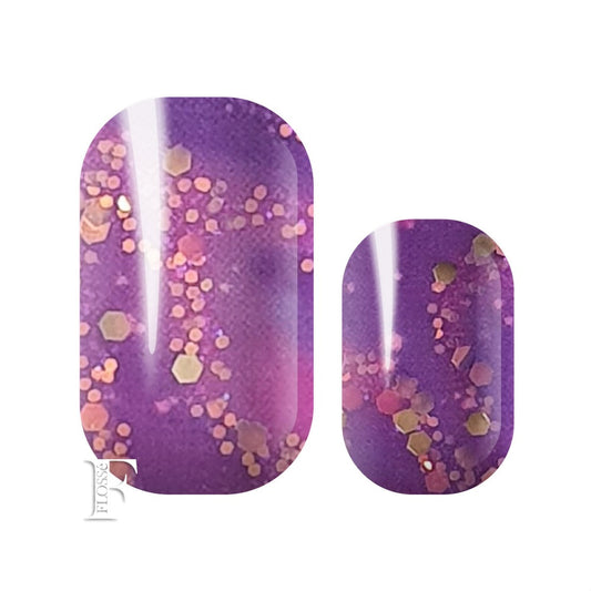 FLOSSé nail wraps with deep purple tones of violet, indigo and dark fuchsia smothered in pink and gold sequins with a dusting of electric blue glitter.